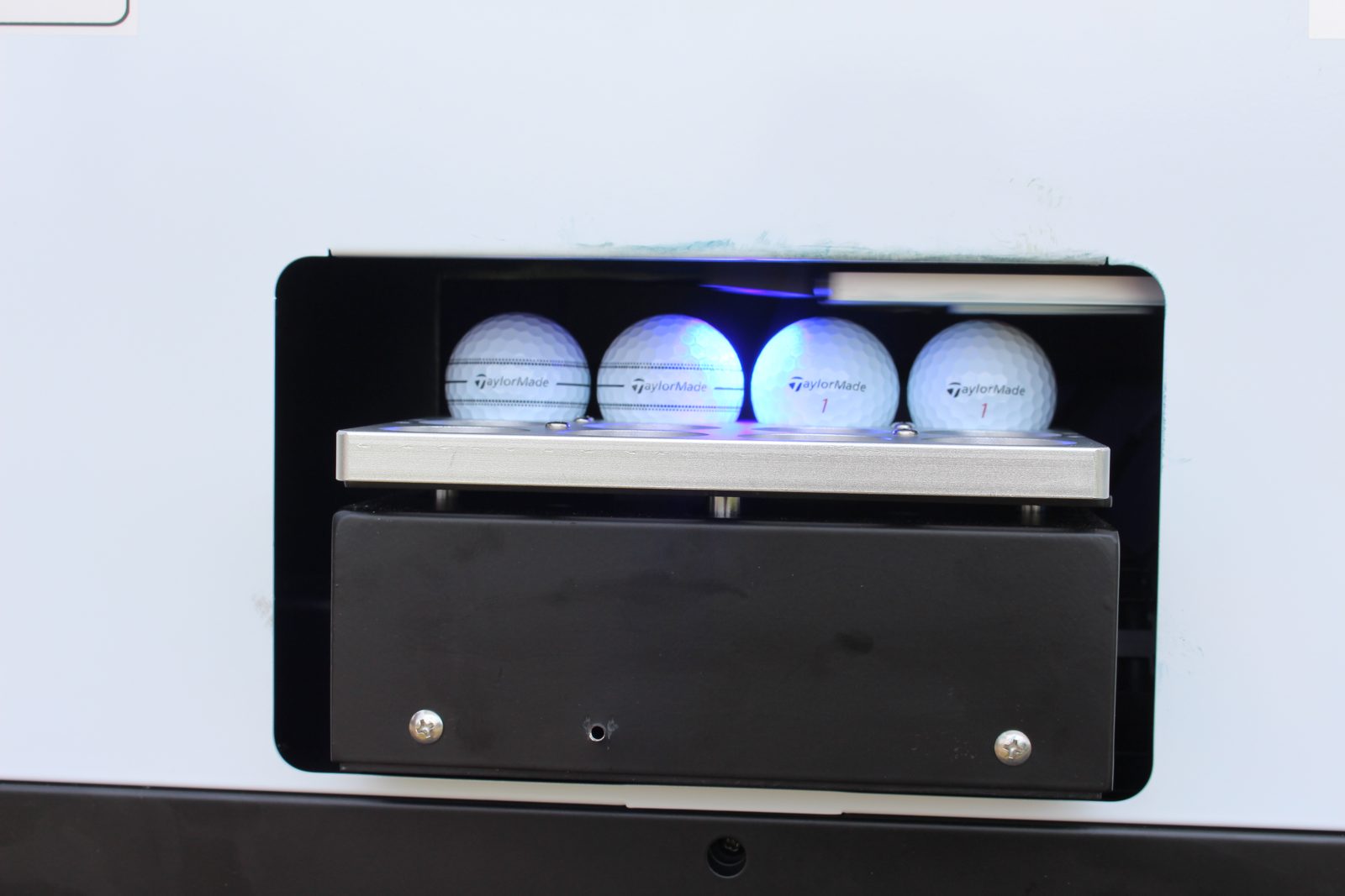 Tray of freshly printed custom golf balls