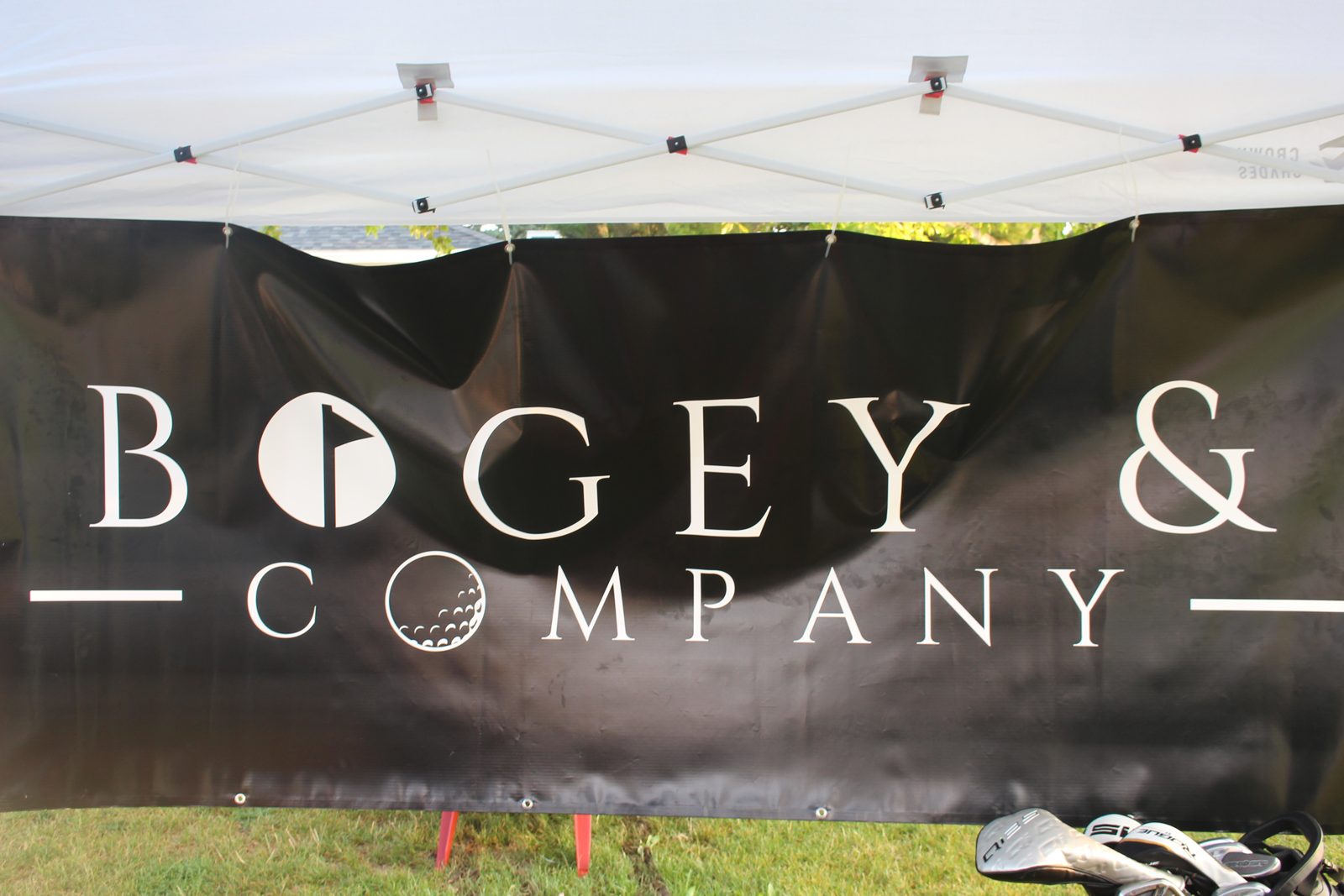 Bogey & Company banner hanging from the event tent